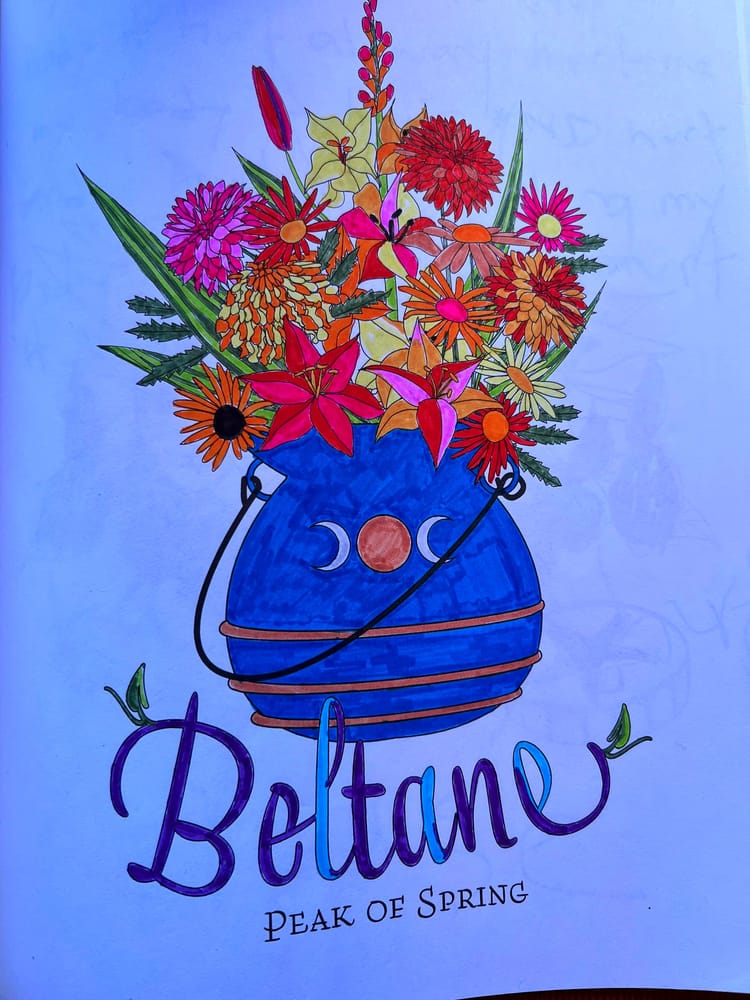 A filled-in coloring-book page that reads, “Beltane: Peak of Spring,” picturing a vase filed with flowers. 